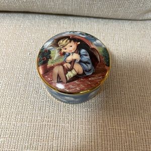 M.I. Hummel. Umbrella girl from the MI Hummel music box collection.